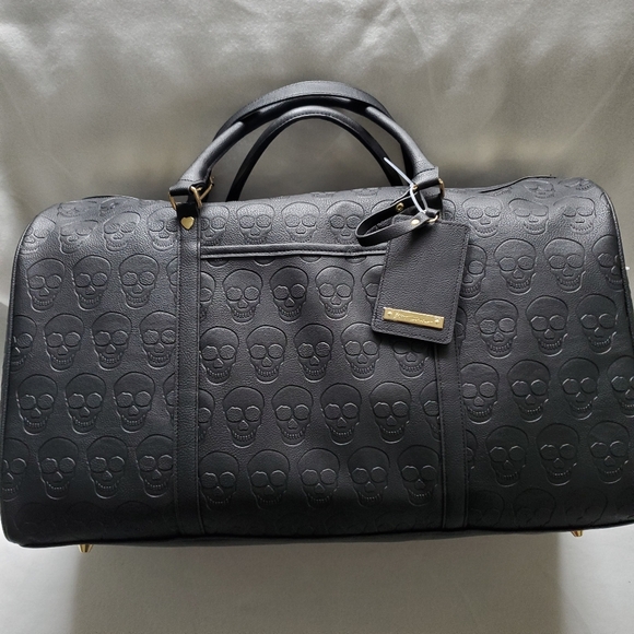 Betsey Johnson Handbags - Betsey Johnson embossed Skull Embossed Weekender Duffle Bag